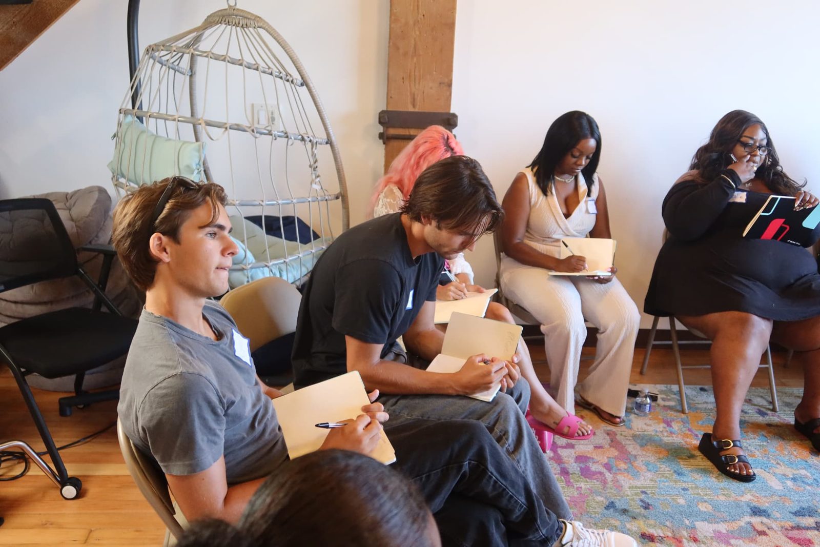 Participants writing during a session