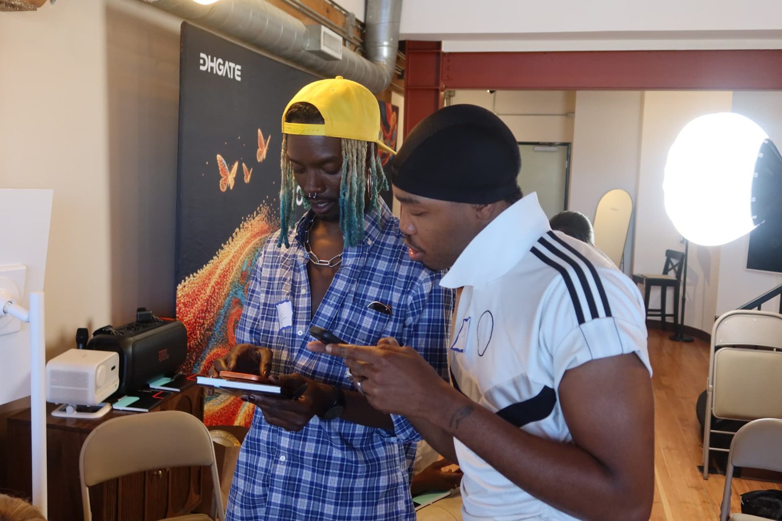 Two participants reviewing work together on set